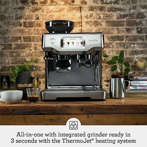 Espresso machine with integrated grinder on wooden counter.