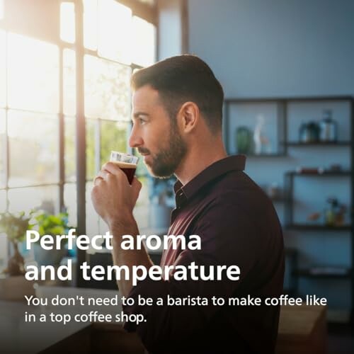 Man enjoying coffee near a window in a cafe