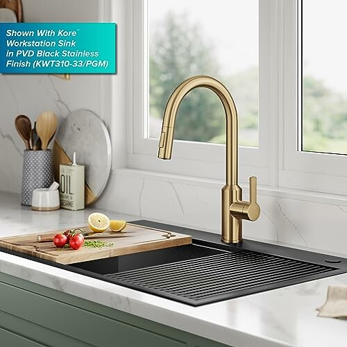 Modern kitchen sink with gold faucet and cutting board.