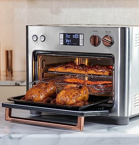 Modern toaster oven with food inside