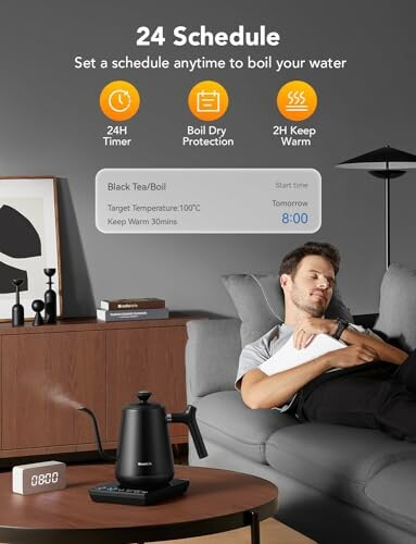 Man sleeping on couch with smart kettle and digital clock on table, showing scheduling features.