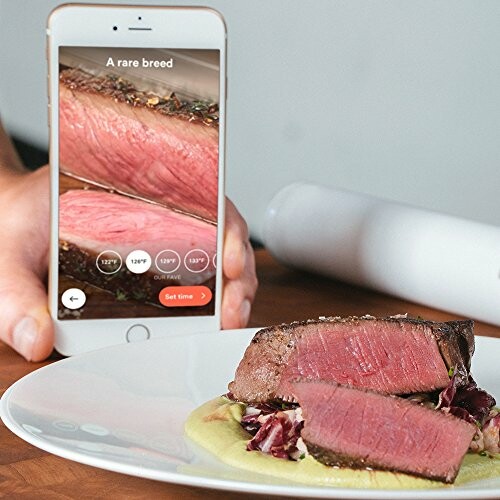 Smartphone app showing steak cooking temperatures with a plate of steak.