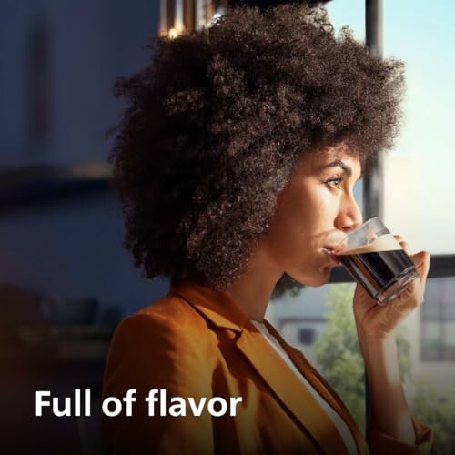 Woman enjoying a coffee by the window